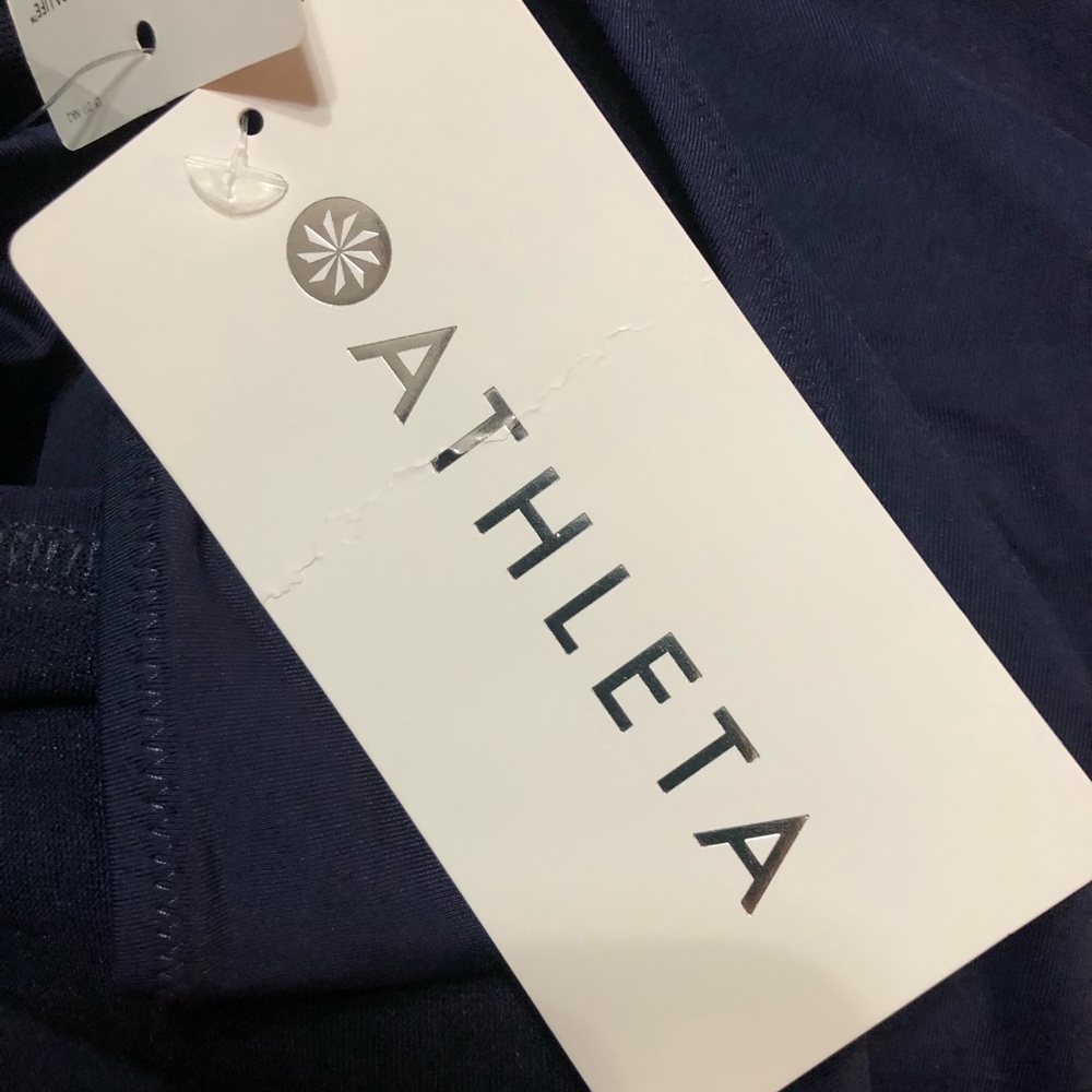 Athleta two piece bathing suit. Navy blue. XL. Never worn. Tags on bottoms.